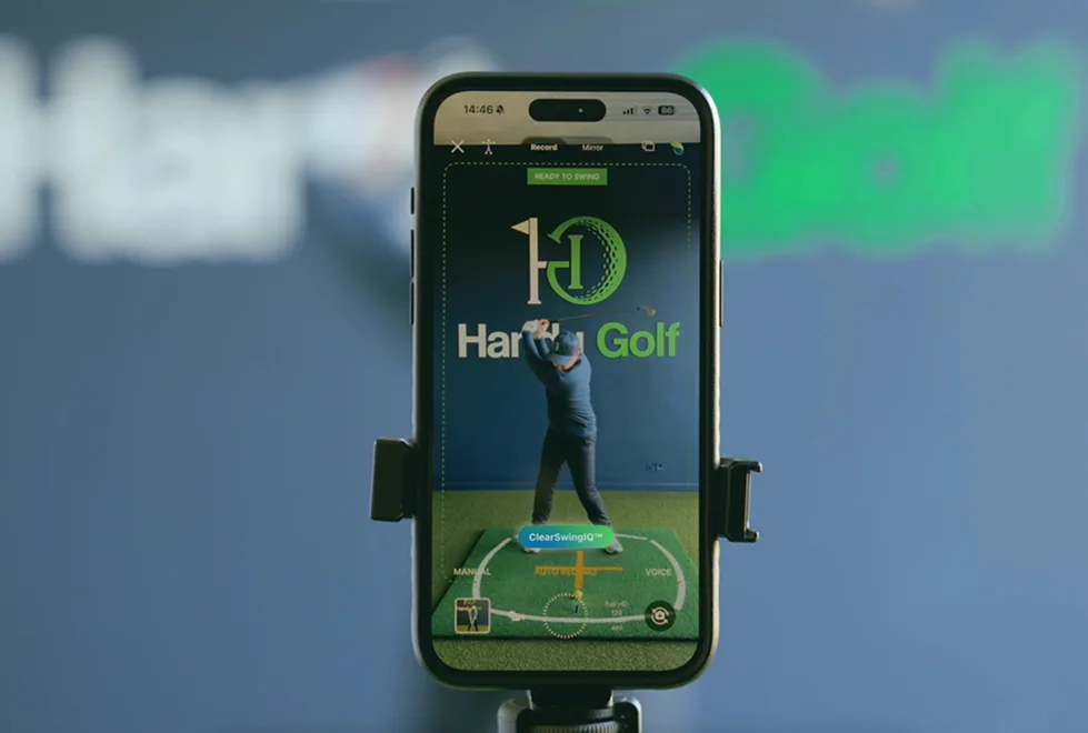 A phone mounted on a tripod, ready to capture the next swing