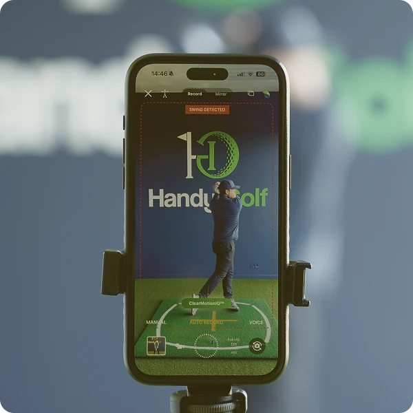 A phone on a tripod detecting and recording a swing automatically