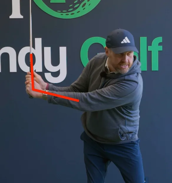 A PGA coach demonstrating a swing position in an on-demand lesson
